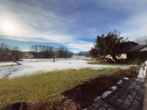 AUSBLICK - Stilvolle Großzügigkeit mit Chiemsee-Blick – verbundene Erdgeschosswohnung in Bestlage